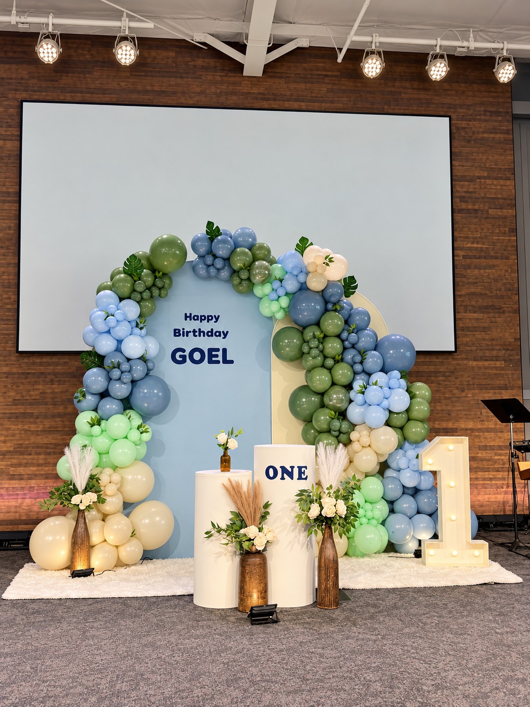Sage-green, dusty-blue, mint and ivory balloon backdrop created for Goel’s first-birthday celebration.